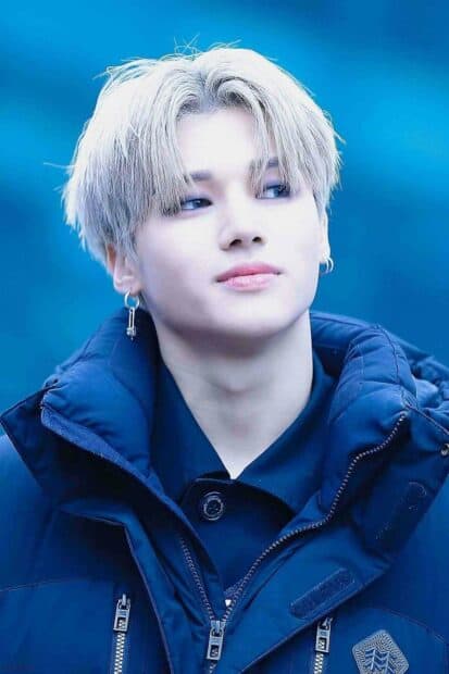 A close up portrait of Jeong Yun Ho wearing a blue jacket with a serene expression, HD Mobile Wallpaper