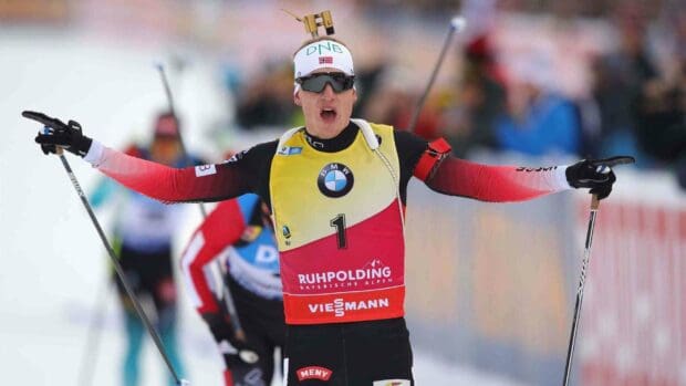 Johannes Thingnes is skiing during a biathlon competition with intense focus, 2K Desktop Wallpaper