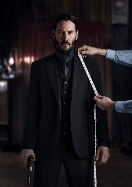 John Wick Chapter 2 Stylish Suit And Gun Desktop Wallpaper