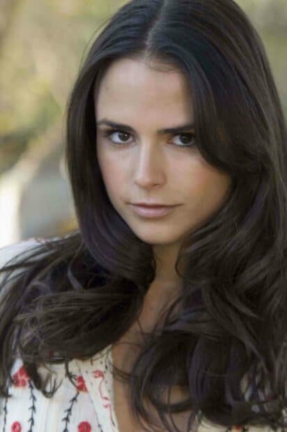 A close up portrait of Jordana Brewster with long dark hair in a natural outdoor setting, 2K Phone Wallpaper