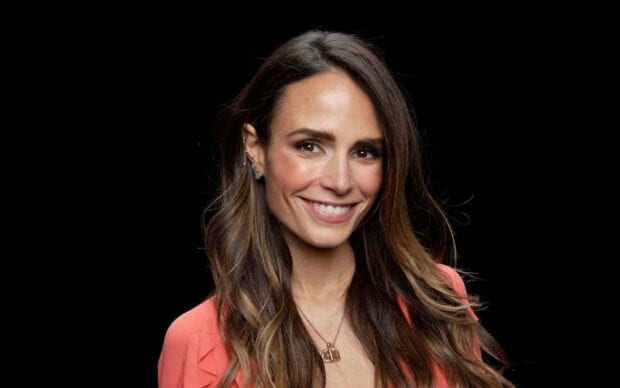 Jordana Brewster smiling against a black background with long wavy hair, HD Desktop Wallpaper
