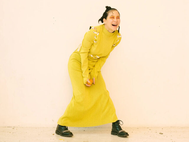 Joyful Japanese Breakfast Band Wallpaper In Yellow Dress