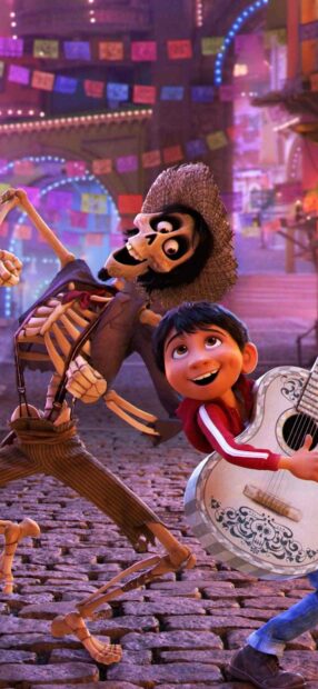 A joyful scene from Coco cartoon wallpapers showing a boy playing guitar with a dancing skeleton in a festive street, HD Phone Wallpaper