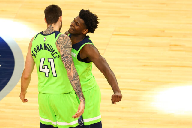 Juancho Hernangomez Celebrates With Teammate In Bright Green Timberwolves Uniform