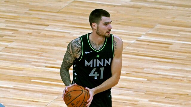 Juancho Hernangomez In Minnesota Timberwolves Jersey Holding Basketball On Court