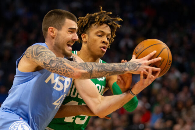 Juancho Hernangomez Intense Basketball Action Defending And Fighting For Ball Possession Wallpapers