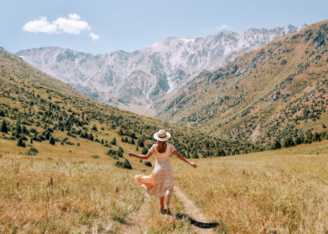 Kazakhstan Landscape Woman In Meadow Mountain Wallpaper
