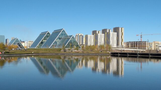 Kazakhstan Modern Architecture And Skyline Reflected On Water