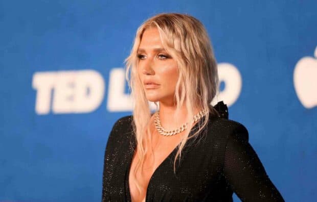 Kesha looks confident wearing a black sequined dress with a gold chain necklace, HD Desktop Wallpaper