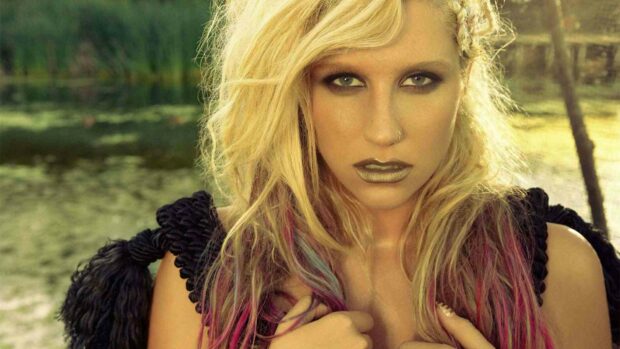 A close up portrait of Kesha with blonde and pink hair standing outdoors near a pond, HD Desktop Wallpaper