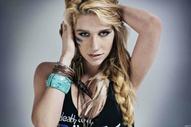 A close up portrait of Kesha with braided hair and bold makeup, 2K Desktop Wallpaper