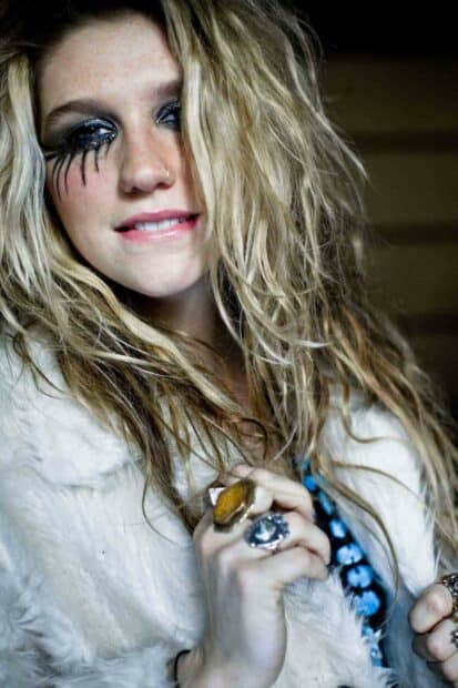 Kesha Wallpapers shows a close up of a woman with glittery black eye makeup and several rings on her fingers, HD Mobile Wallpaper