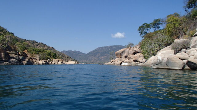 Lake Malawi Scenic View Serene Waters And Rocky Shores Wallpaper