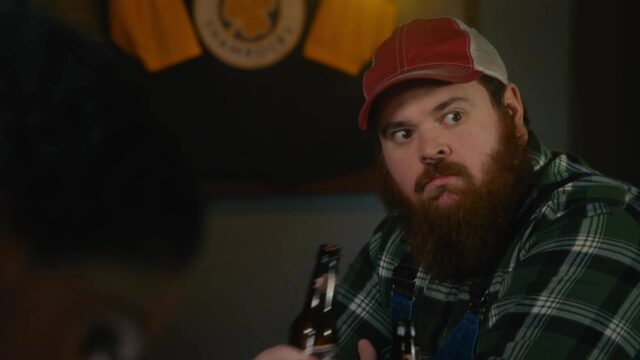 Letterkenny TV Series Wallpaper Featuring Bearded Character In Red Cap And Plaid Shirt