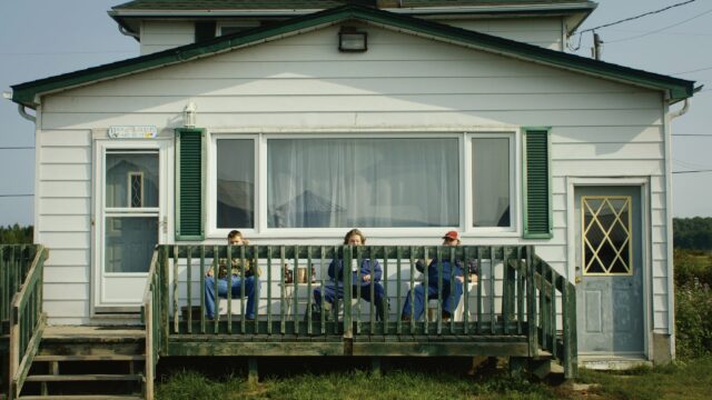 Letterkenny TV Series Wallpaper Three Characters Relaxing On Porch In Rural Setting
