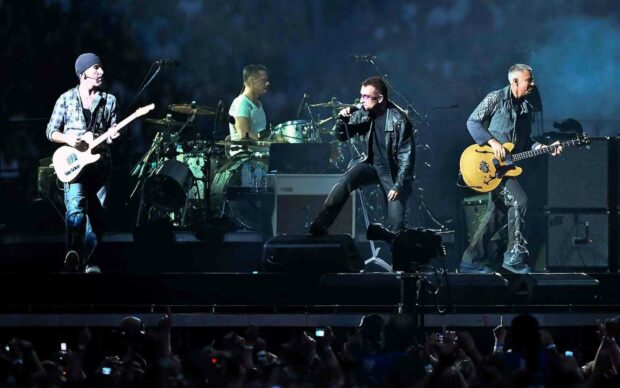 A live band is performing on stage during a concert with a large audience, HD Desktop Wallpaper