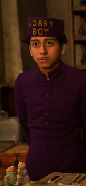 Lobby Boy Character from The Grand Budapest Hotel Wallpapers in Purple Uniform