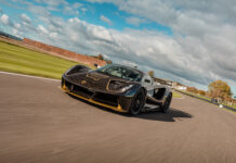 Lotus Evija Black And Gold Racing Wallpaper High Speed Track Action