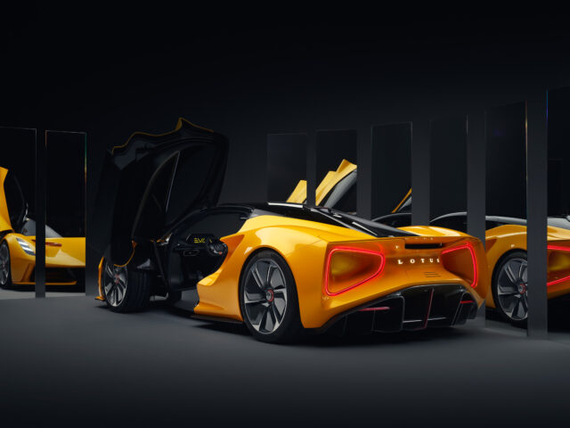 Lotus Evija Wallpapers Featuring Yellow Hypercar Surrounded By Mirrors In Dark Studio