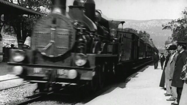 Lumiere Brothers Classic Train Arrival Scene Wallpaper