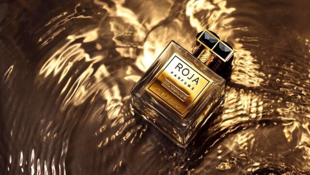Luxurious Roja Dove Parfum Bottle On Shimmering Gold Background