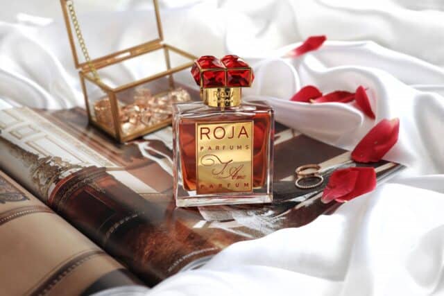 Luxurious Roja Parfums Bottle On Elegant Silk Background