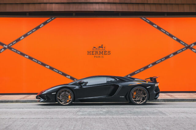 Luxury Car In Front Of Hermes Paris Orange Wall