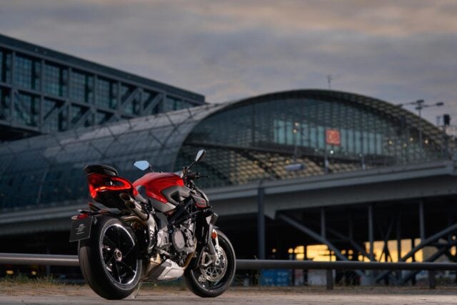 MV Agusta Brutale 1000 Red Motorcycle Parked with Modern Architectural Background Wallpaper