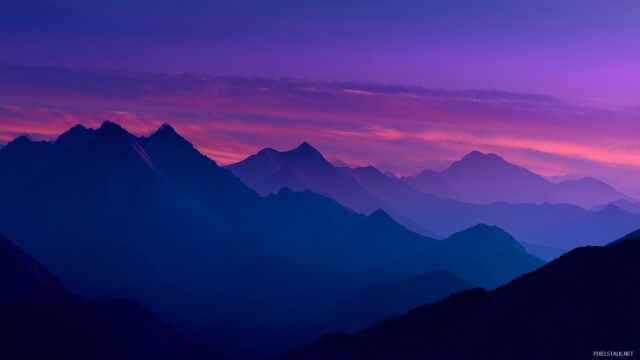 Mac OS X HD Background, A Dramatic Mountain Range At Twilight, Silhouetted Against A Backdrop Of Deep Blue And Purple Hues In The Sky
