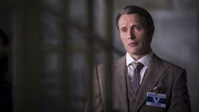 Mads Mikkelsen Elegant Suit Portrait Wallpaper