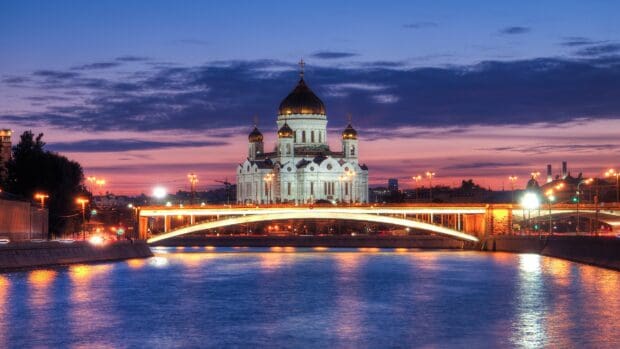 A majestic cathedral with golden domes is illuminated at dusk by the river, Cathedral Wallpapers, 4K Desktop Wallpaper