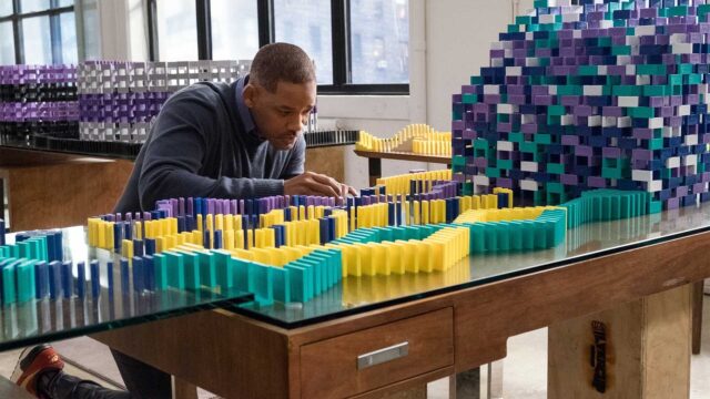 Man Contemplating Dominoes Artwork In Collateral Beauty Scene