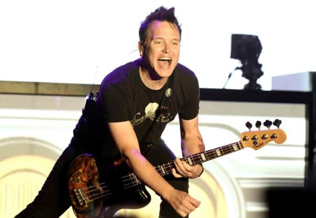 Mark Hoppus enthusiastically plays guitar during a live performance, 2K Desktop Wallpaper