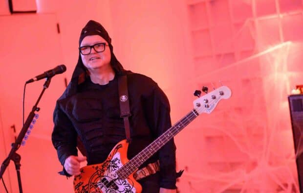 Mark Hoppus is performing live on stage holding a bass guitar, HD Desktop Wallpaper