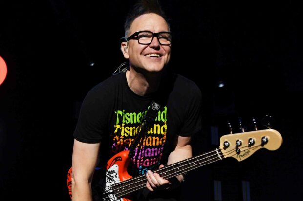 Mark Hoppus is smiling while playing his bass guitar on stage, HD Desktop Wallpaper