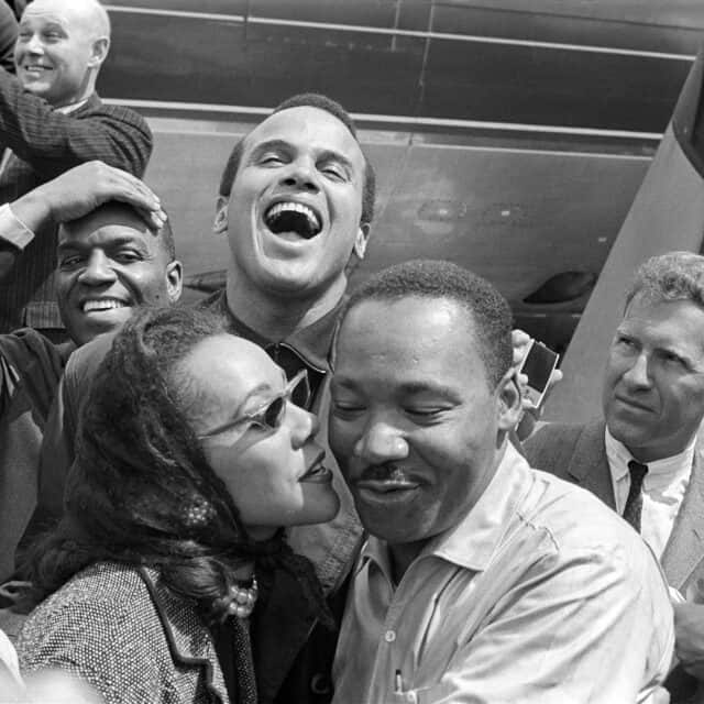 Martin Luther King Jr Smiling Iconic Historical Moment Wallpaper