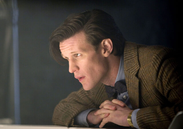 Matt Smith as the Eleventh Doctor leaning forward thoughtfully, 2K Desktop Wallpaper