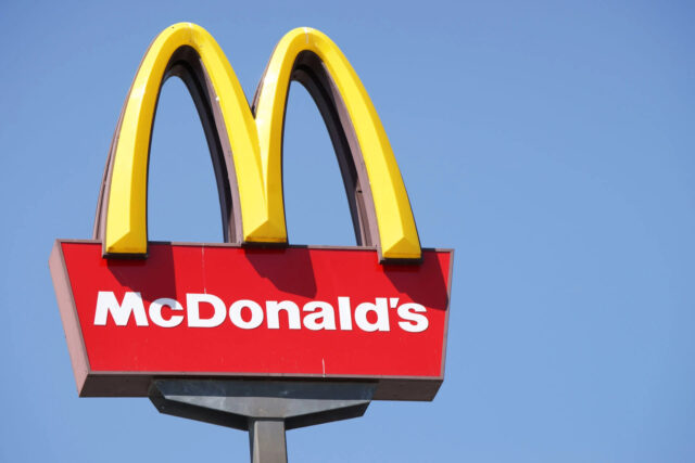 McDonalds Logo Sign on Clear Blue Sky Background for McDonalds Wallpapers