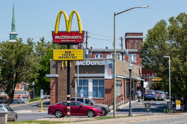 McDonalds Restaurant Exterior with New Chicken Sandwiches Sign and Drive Thru Queue