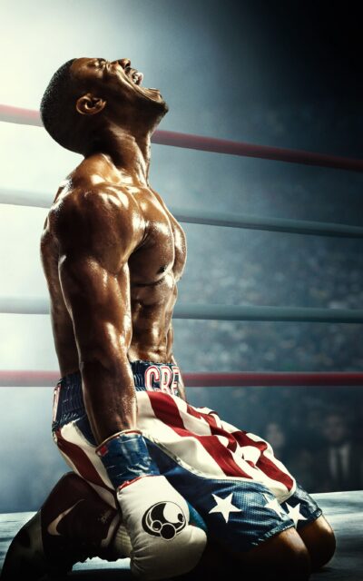Michael B Jordan Powerful Moment in Boxing Ring Wallpaper with American Flag Shorts