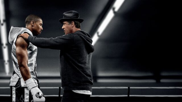Michael B Jordan Training Scene with Mentor Inspiring Focus in Boxing Ring Wallpaper