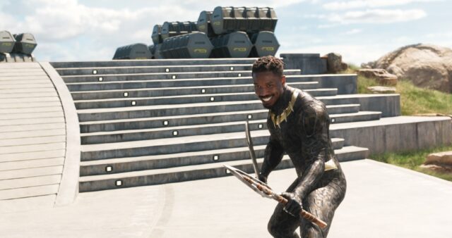 Michael B Jordan as Black Panther Holding Spears in Action Pose Wallpaper