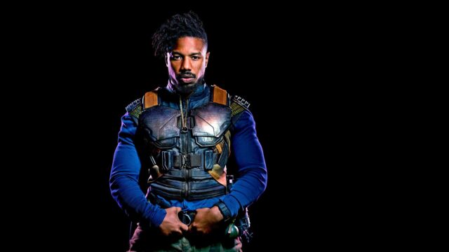 Michael B Jordan in Tactical Gear Intense Pose Black Background Wallpaper