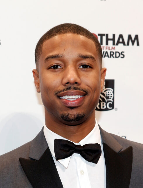 Michael B Jordan in a Stylish Tuxedo Smiling at Gotham Awards Event Wallpaper