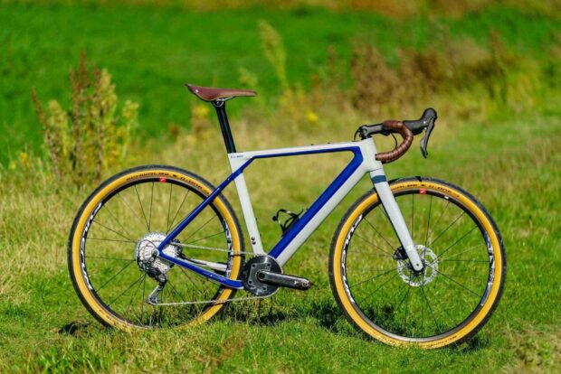 A 3T bike is positioned on green grass with clear details of its frame and wheels, HD Desktop Wallpaper