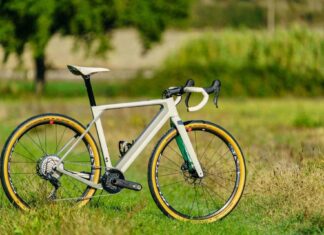 A 3T bike with yellow tires stands on a grassy field under natural light, HD Desktop Wallpaper