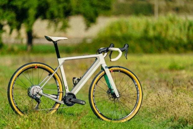A 3T bike with yellow tires stands on a grassy field under natural light, HD Desktop Wallpaper