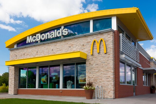 Modern McDonalds Restaurant Exterior with Yellow Arch Design in Clear Sky McDonalds Wallpapers