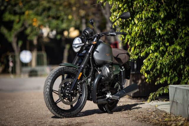 Moto Guzzi V7 Classic Motorcycle Parked on Sunny Street Wallpaper