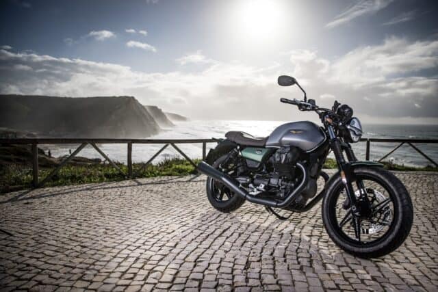 Moto Guzzi V7 Motorcycle Parked by Scenic Coastline with Ocean View Wallpapers